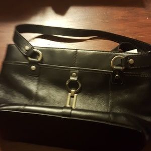 Etienne Signer brand ,leather